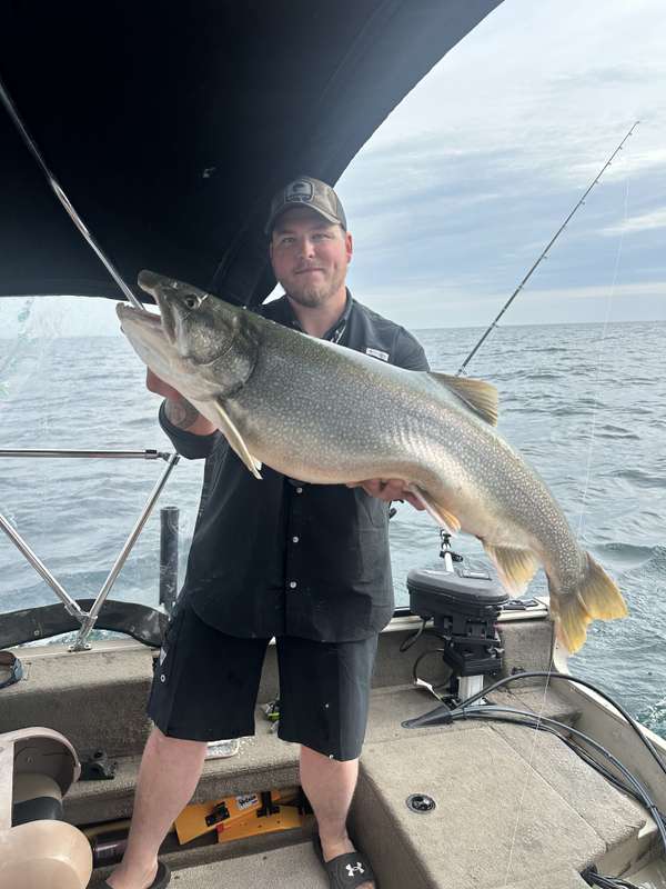 Captain Jesse with a massive Lake Ontario lake trout